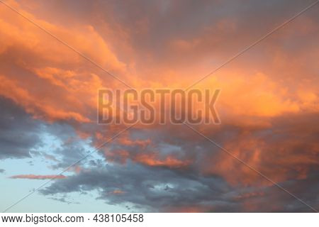 Romantic Sky Background With Red And Orange Colored Clouds From The Setting Sun