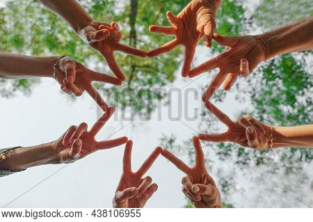Team Stacks Hands In A Workshop For Teambuilding And Teambuilding