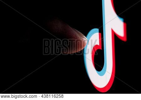 Kazan, Russia - Oct 31, 2021: The Finger Reaches For The Tiktok Social Network Logo On The Smartphon