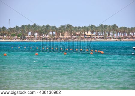 Yellow Buoys Floating On Sea Surface As Marker For Swimming Restriction In Deep Water At Tropical Re
