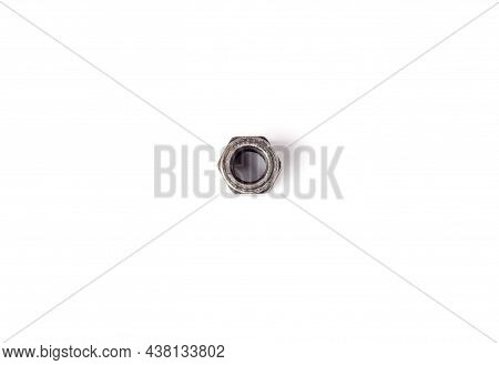 One Macro Metallic Nut Isolated On White Background. Heavy Hex Nut. Female Screw Nut With Copy Space