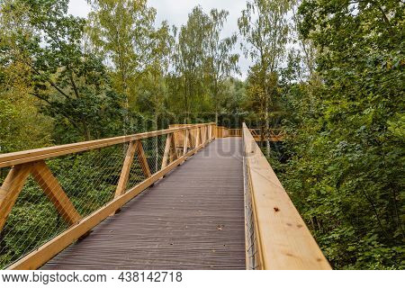 Footbridge Among Trees Over Small Szklarka River