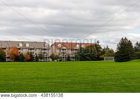 Residential House With Apartments Or Condo Building And Soccer Field Near Park In Ottawa City Of Can
