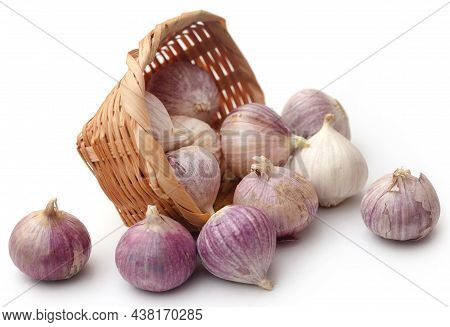 Solo Or Single Clove Garlic In A Basket Over White Background