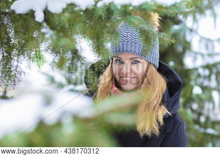 Portrait Beautiful Happy Girl Whitework Smile Teeth, Blue Eyes On Spruce Background In Frosty Day. A