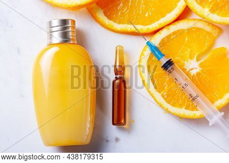 Vitamin C, Natural Anti Aging Cosmetics Cream Bottle And Serum Ampula