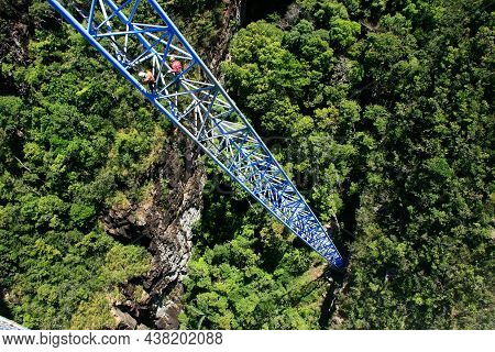 Workers Climing Supporting Pole, Sky Bridge, Langkawi Island, Malaysia
