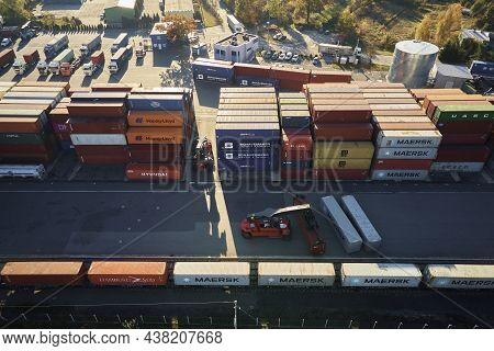 Containers Warehouse On Platform With Cranes And Forklifts, Aerial View. Business And Logistic Conce