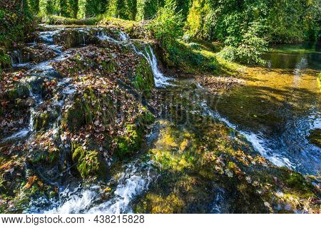 The forest surround the river. Cascade of waterfalls on the Korana River. The small Croatian town of Slunj. The concept of ecological, active and photo tourism