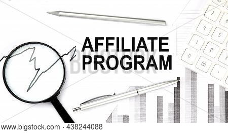 Affiliate Program Text On The Document With Pen,graph And Magnifier,calculator