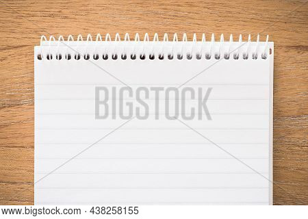 Spiral Notebook Secretary Note Pad On A Wooden Desk. Flat Lay Template Or Background