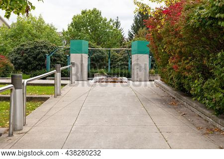 Entrance To Centrepointe Public Park With Small Fountain In Ottawa, Canada In Autumn Season