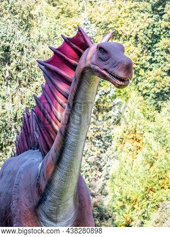 Ukraine, Khmelnitsky, October 2021. Dinosaur, Amargasauruss Close Up With Open Mouth And With A Long