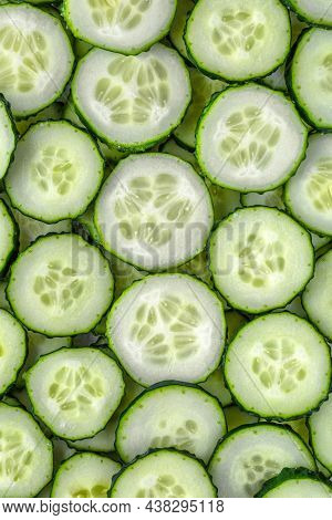 A Background Of Chopped Fresh Cucumbers For The Kitchen.cucumbers Background.cucumbers For Salads Or