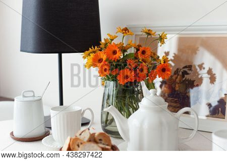 Round Table For Morning Fresh Tea With A White Tablecloth And Flowers Bouquet. Set For Tea-time. Ind
