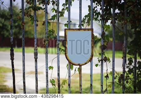 Old Rusty Iron Gate With A Deadbolt. Old Rusty Iron. Rusty Grungy Old Metal Texture For Use As A Bac