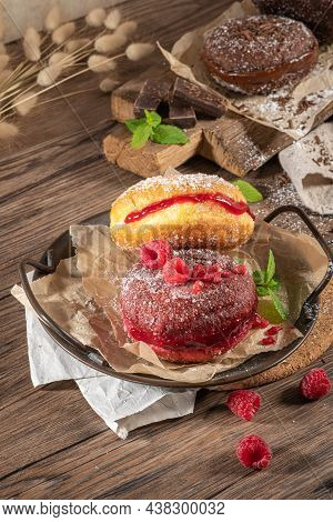 Bolas De Berlim, Or Berlin Balls. Portuguese Fried Dough With Sugar, Filled With Chocolate Or Raspbe