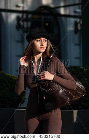 Fashionable Young Brunette Woman With Long Legs Wearing Solid Long Sleeve Bodycon One Piece Jumpsuit