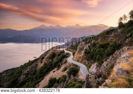 The D824 Road Winding Its Way Along The Coast From Capu Rossu Towards Piana On The West Coast Of Cor