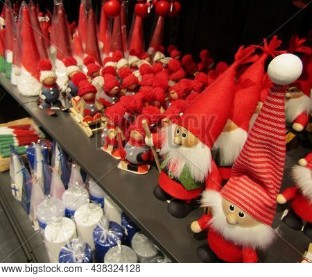 Christmas Nisse Gnomes, Candles And Toys On Shelves