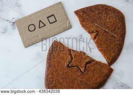 Kiev Ukraine - October 2021 Squid Game Invitation Card Star Shape Homemade Sugar Candy. Playing Kore