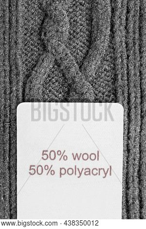 Fabric Composition Clothing Label On Black Knit Background