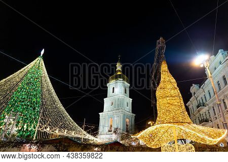 Beautiful Scenic Decorated Christmas Tree With Decorations And Illuminated By Light Garlands Against
