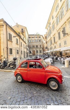 Vintage Fiat 500 Parked Next To A Restaurant In Rome In The Inner City At Quarter Regla On Cobblesto
