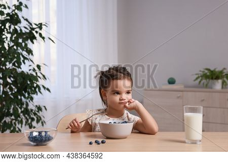 Cute Little Girl Refusing To Eat Her Breakfast At Home