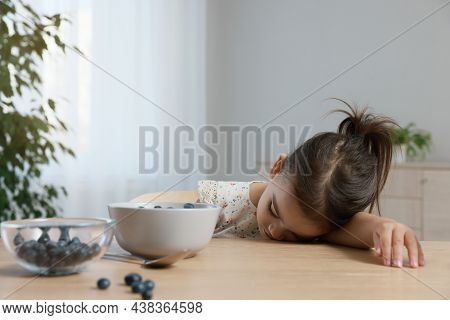 Cute Little Girl Refusing To Eat Her Breakfast At Home