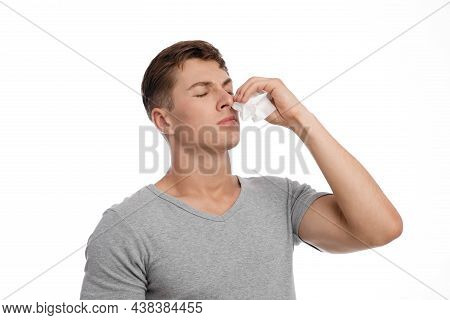Disappointment Sad Young Caucasian Handsome Guy Presses Napkin To Nose And Suffers Bleeding Or Runny