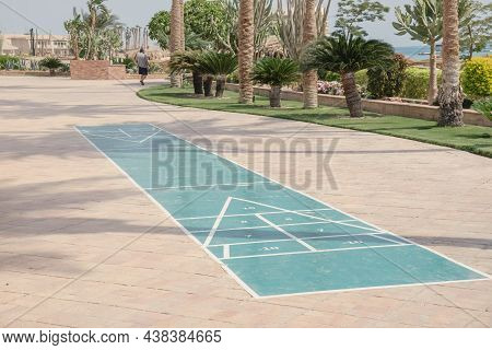 Lined Playground For Playing In Shuffleboard In The Seaside Resort. Popular English Game. Floor Area