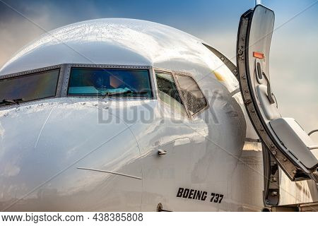 Bees Airline Yellow Plane On The Apron. Boeing 737-800 Ur-uba Passenger Aircraft. After Rain And Was
