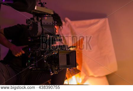 Movie Shooting Or Video Production And Film Crew Team With Camera Equipment. Video Camera Operator W