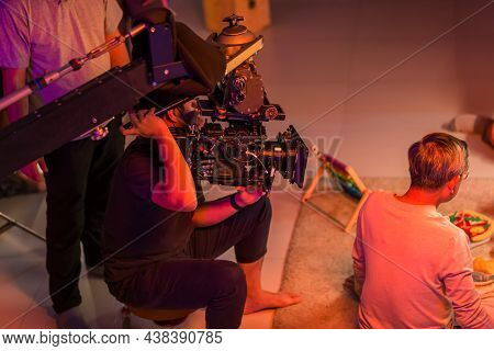 Movie Shooting Or Video Production And Film Crew Team With Camera Equipment. Video Camera Operator W