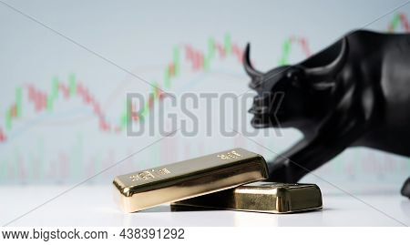 Focus On Gold Bars, Concept Of Bullish Or Boom In Gold Market Shares Or Stocks Showing By Bull Behin