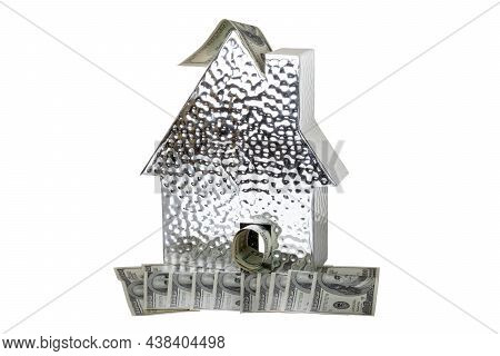 Business, Money And Finance Concept. A Metallic House Model With Many $100 Banknotes Isolated On A W