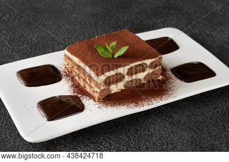 Portion Of Tiramisu - Italian Dessert Garniched With Chocolate
