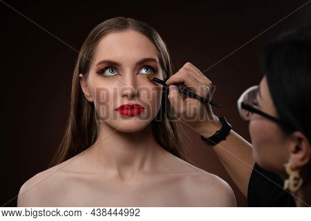 Close Up On Model. Beautiful Model At Muah Artist. Beauty Makeup Artist Working On A Fashion Model F