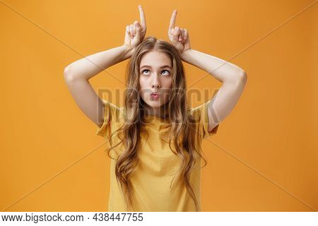 Girl Going Crazy From Boredom Making Freaky Funny Faces Fooling Around Squinting Holding Index Finge