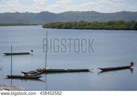 Canoes And Boats Docked On The Bank Of The Grand Paraguacu River.