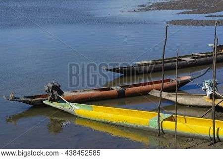 Canoes And Boats Docked On The Bank Of The Grand Paraguacu River.