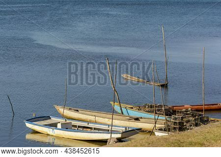 Canoes And Boats Docked On The Bank Of The Grand Paraguacu River.