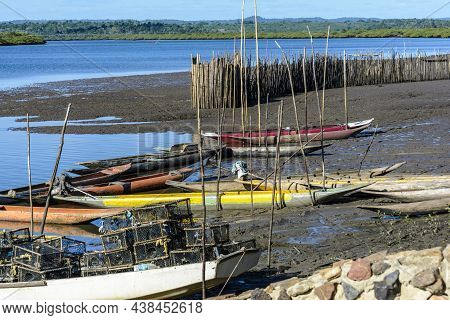Canoes And Boats Docked On The Bank Of The Grand Paraguacu River.