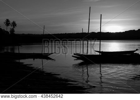 Cachoeira, Bahia, Brazil - November 29, 2014: Silhouette At Sunset Of Canoes Docked In The Grandiose