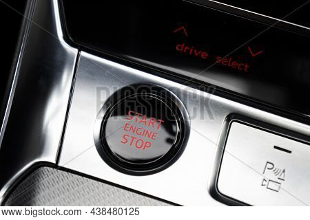 Car Dashboard With Focus On Engine Start Stop Button. Modern Car Interior Details. Start/stop Button