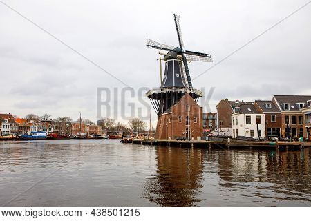 Cityscape Of Haarlem, The Netherlands. View Of Old Windmill And Typical Dutch Houses.