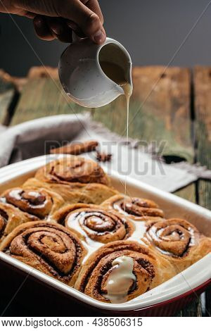 Baked Sweet Cinnamon Rolls On A Wooden Table. Sinnabon Buns Rolls. Swedish Dessert.
