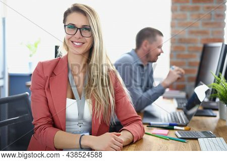 Portrait Of Attractive Woman In Presentable Outfit On Working Place, Colleagues Work Together And Sh