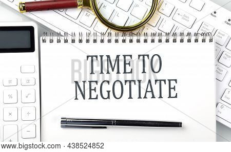 Time To Negotiate Text On The Notepad With Calculator And Keyboard,business Concept